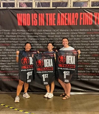 CrossFit Surge team with first-place DEKA team banners