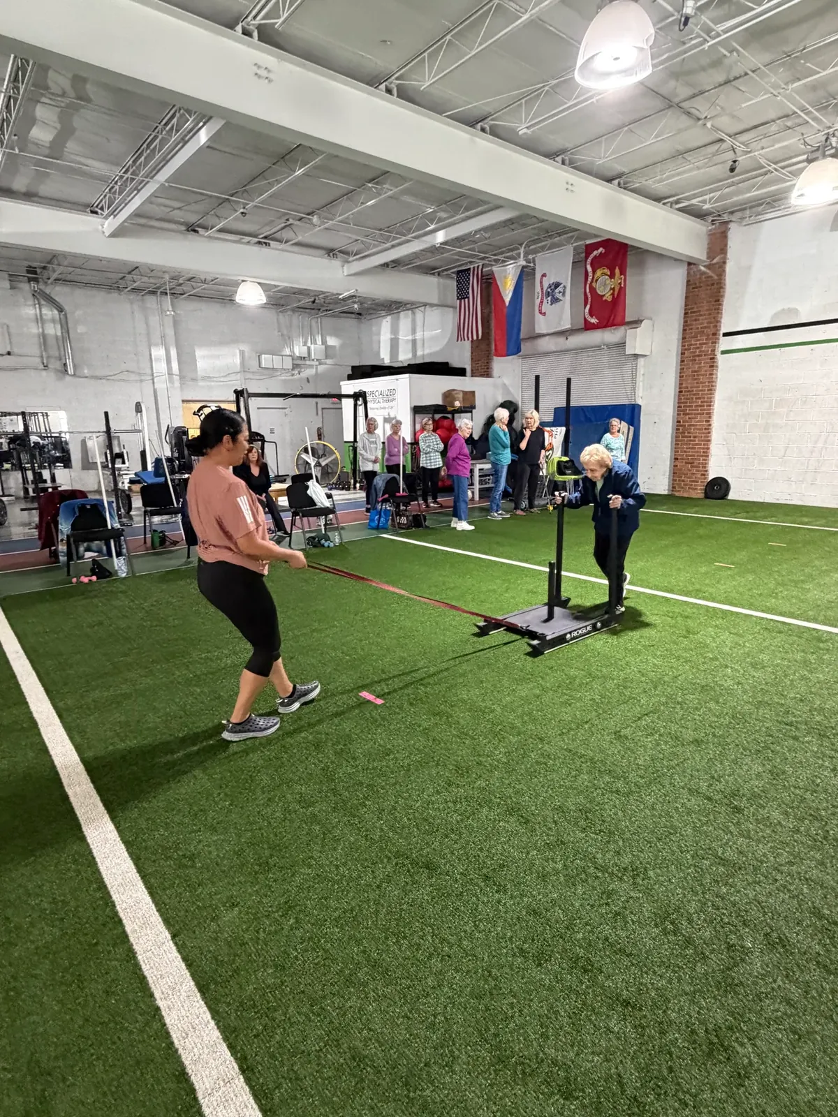 Senior Fitness members training on the turf