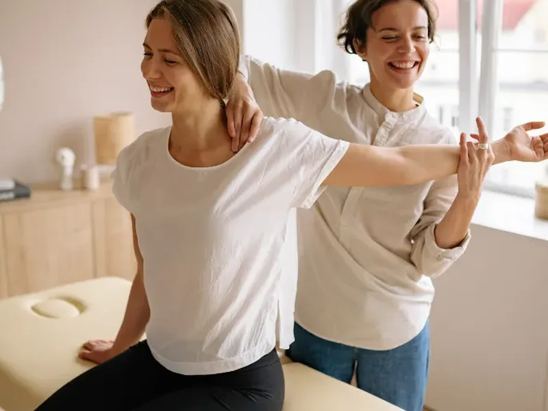 Patient working through guided mobility exercises with a therapist